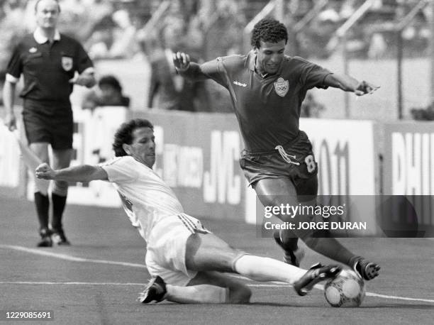 File picture dated June 11, 1986 shows Portugal's Jose Pimental tackling Morocco's Bouderbala El Idrissi , 11 June 1986 in Guadalajara, during the...