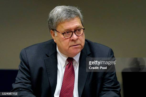 Attorney General William Barr meets with members of the St. Louis Police Department during a round table discussion on Operation Legend on October...