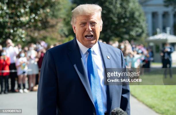President Donald Trump speaks to the press as he departs the White House in Washington, DC, on October 15, 2020. - Trumps travels to North Carolina,...