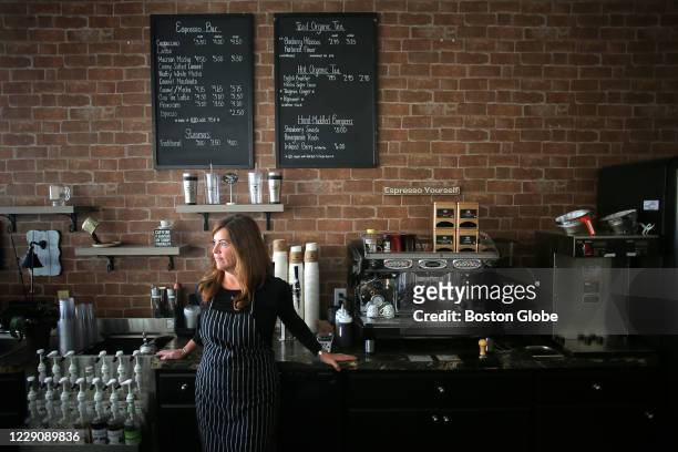 Sandra Martin, owner of Elvera's Cafe, poses for a portrait inside the coffee shop in Brockton, MA on Oct. 8, 2020. She has kept her shop closed...