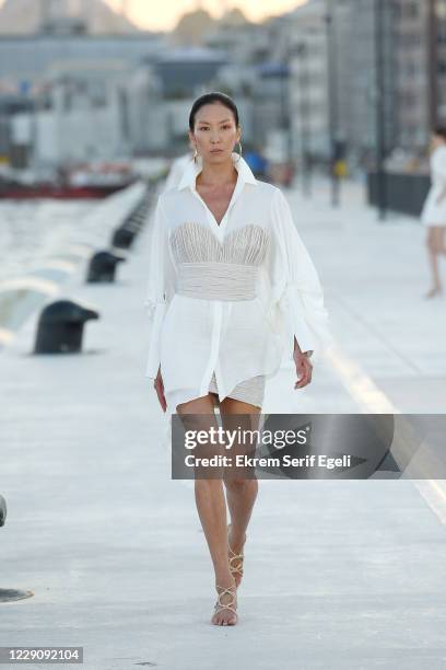 In this image released on October 15, A model walks the runway during the Özgür Masur show during Mercedes-Benz Istanbul Fashion Week at Galataport...