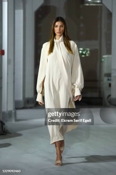 In this image released on October 15, A model walks the runway during the Özlem Kaya show during Mercedes-Benz Istanbul Fashion Week at Galataport...