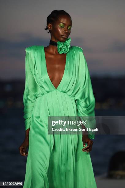 In this image released on October 15, A model walks the runway during the Özgür Masur show during Mercedes-Benz Istanbul Fashion Week at Galataport...