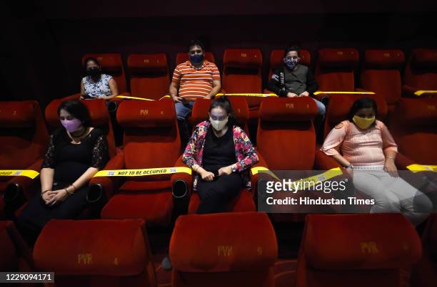 Family members of frontline Covid-19 workers watch a movie at PVR DLF Mall at Vasant Kunj on October 15, 2020 in New Delhi, India. Cinema halls...