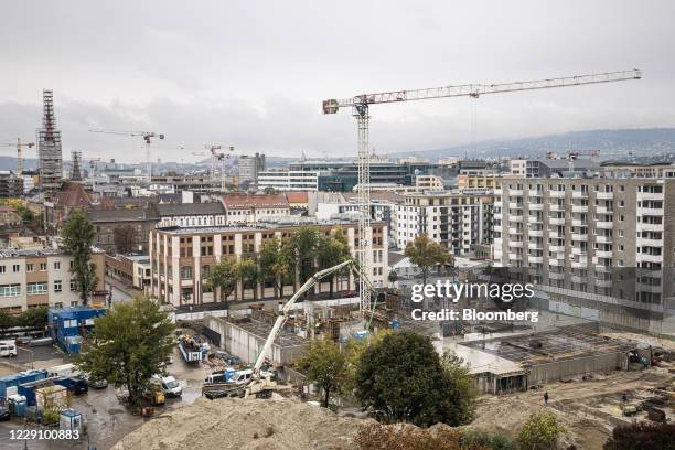 Cranes tower over under-construction residential sites in Budapest, Hungary, on Wedsday, Oct. 14, 2020. Hungary will cut the value-added tax on...