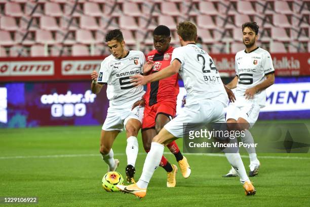 Nayef AGUERD of Rennes and Eric Junior DINA EBIMBE of Dijon during the Ligue 1 match between Dijon FCO and Stade Rennes at Stade Gaston Gerard on...