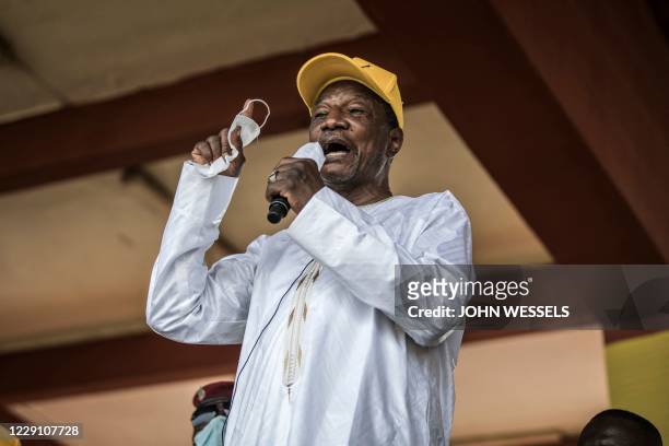 Current President and presidential candidate, Alpha Conde addresses his supporters at a campaign rally in Conakry on October 16, 2020. - The...