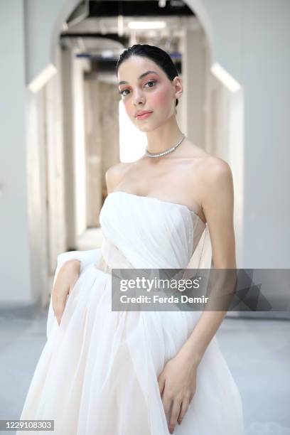 In this image released on October 16, A model is seen backstage ahead of the Museum of Fine Clothing show during Mercedes-Benz Istanbul Fashion Week...