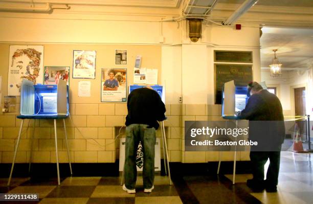 Voters cast ballots at Cranston City Hall in Cranston, RI on Oct. 13, 2020. Voters cast ballots in the first day of early voting in Rhode Island.