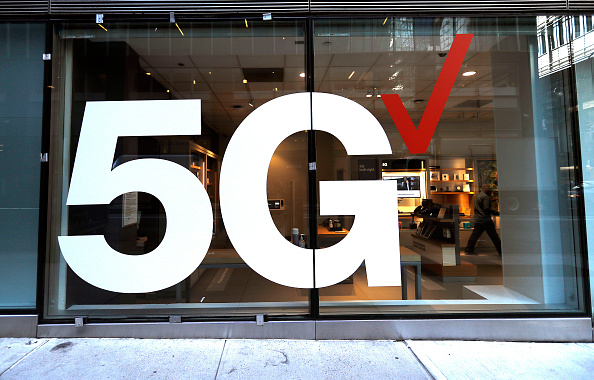 Verizon store front displays the 5G network near Grand...