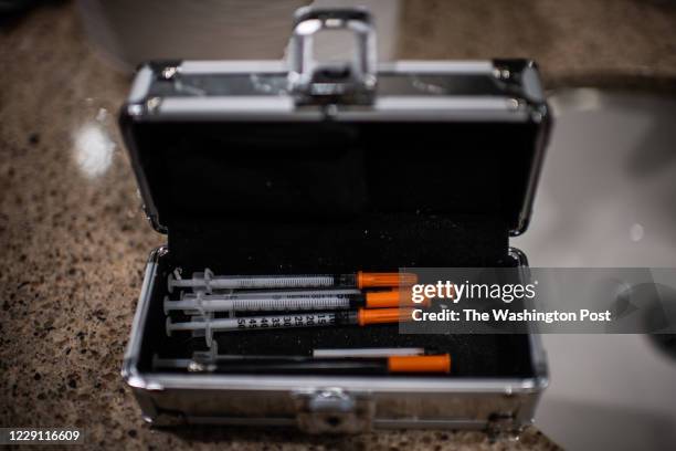 Kit is seen on the sink during a woman being questioned by police who are accompanied by Manchester firefighters after she was preparing to shoot...