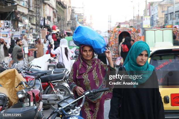 View of from a crowded marketplace as Pakistanis appear to avoid coronavirus measures such as wearing face masks and keeping social distance in...