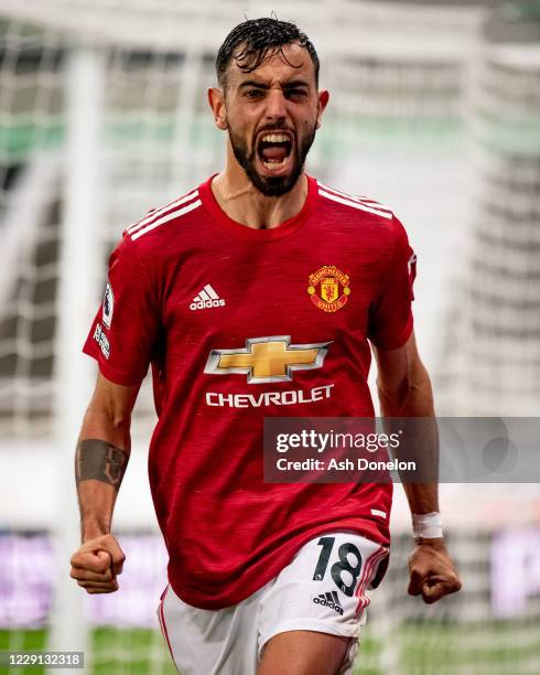 Bruno Fernandes of Manchester United celebrates scoring a goal to make the score 1-2 during the Premier League match between Newcastle United and...