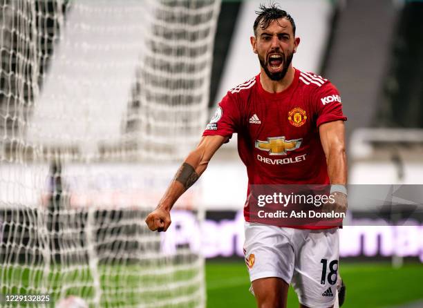 Bruno Fernandes of Manchester United celebrates scoring a goal to make the score 1-2 during the Premier League match between Newcastle United and...