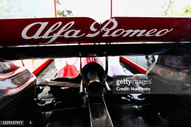 Alfa Romeo logo is seen on the Formula 1 car Sauber C-37 in the livery of Alfa Romeo Racing-Ferrari, in the showcase at a gas station in Krakow,...