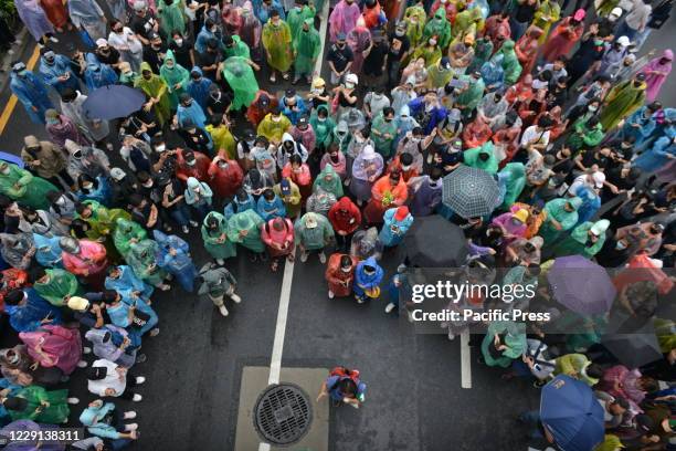 Protesters with personal protective equipment such as helmets and protective masks, ready should the police decide to control the crowd to dissolve...