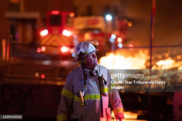 Minneapolis, MN May 27: Neighbors fought with garden hoses and buckets to save homes after rioters set fire to a multi-story affordable housing...