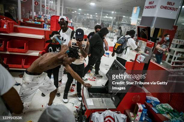 Minneapolis, MN May 27: A looter tried to break in the cash register. Looters entered the Target store on Lake Street and made out with merchandise...