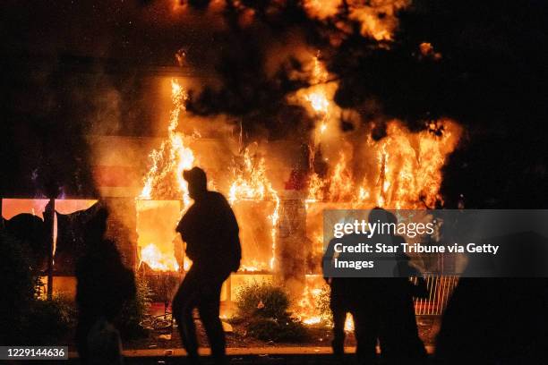Minneapolis, MN May 27: AutoZone burned as protesters continued to gather outside of the Third Precinct. Protester and police clashed violently in...