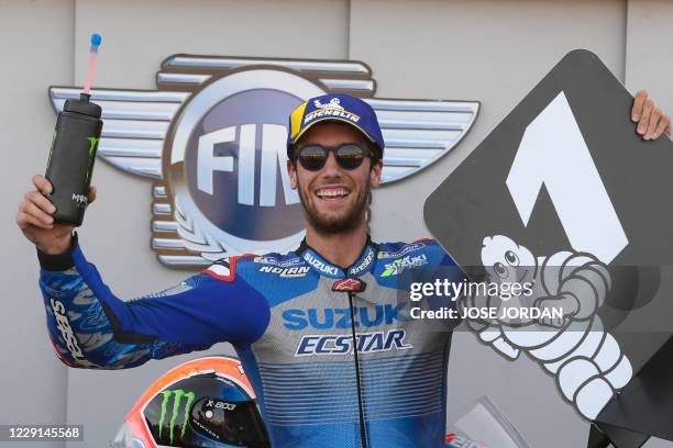Suzuki Ecstar's Spanish rider Alex Rins celebrates after winning the MotoGP race of the Moto Grand Prix of Aragon at the Motorland circuit in Alcaniz...