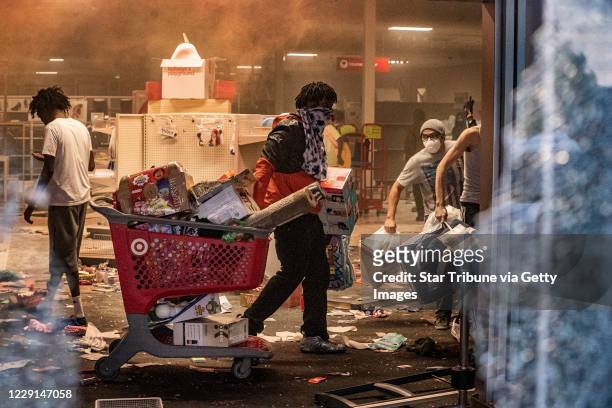 Minneapolis, MN May 27: Looters entered the Target store on Lake Street and made out with merchandise on the second day of protest in the death of...