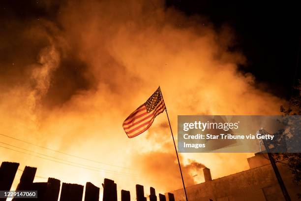 Minneapolis, MN May 27:Neighbors fought with garden hoses and buckets to save homes after rioters set fire to a multi-story affordable housing...