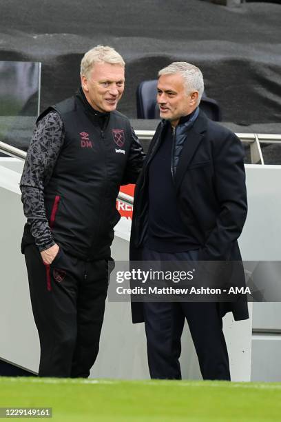 David Moyes the head coach / manager of West Ham United and Jose Mourinho the head coach / manager of Tottenham Hotspur during the Premier League...