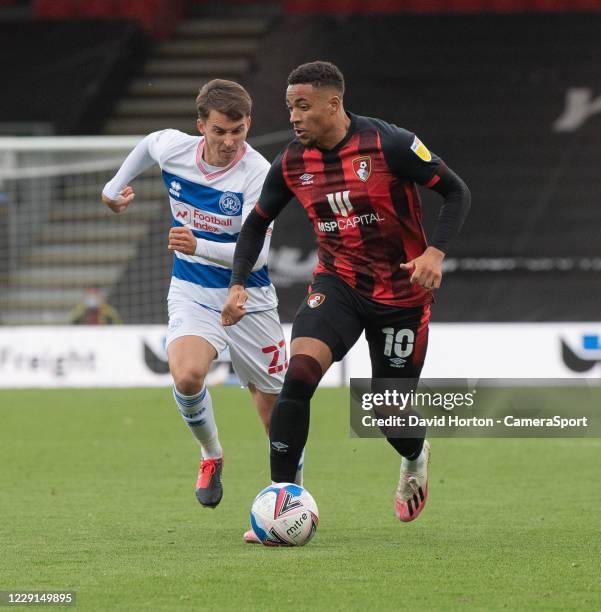 Bournemouth's Arnaut Danjuma under pressure from Queens Park Rangers' Tom Carroll during the Sky Bet Championship match between AFC Bournemouth and...