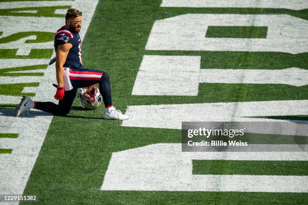Julian Edelman of the New England Patriots looks on before a game against the Denver Broncos at Gillette Stadium on October 18, 2020 in Foxborough,...