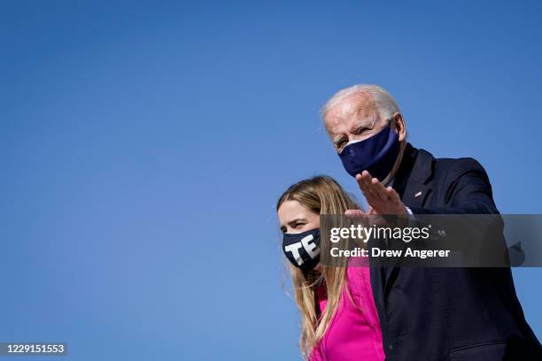Democratic presidential Joe Biden and his granddaughter Finnegan Biden arrive at Raleigh-Durham International Airport on October 18, 2020 in...