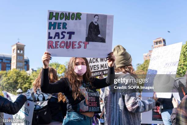 Protester holds a placard expressing her opinion at Washington Square Park during the demonstration. Thousands took to the streets across the US for...