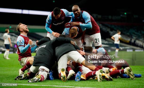 West Ham players celebrate after West Ham United's Argentinian midfielder Manuel Lanzini scored their thrid goal during the English Premier League...
