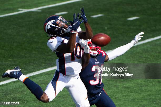Jonathan Jones of the New England Patriots breaks up a pass intended for Jerry Jeudy of the Denver Broncos in the first half at Gillette Stadium on...