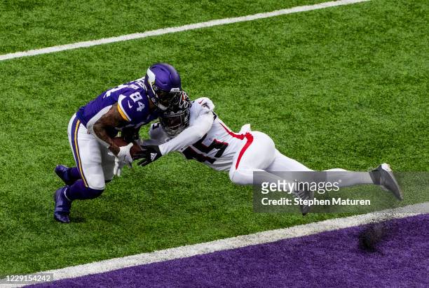 Deion Jones of the Atlanta Falcons breaks up a pass to Irv Smith of the Minnesota Vikings in the second quarter of the game at U.S. Bank Stadium on...