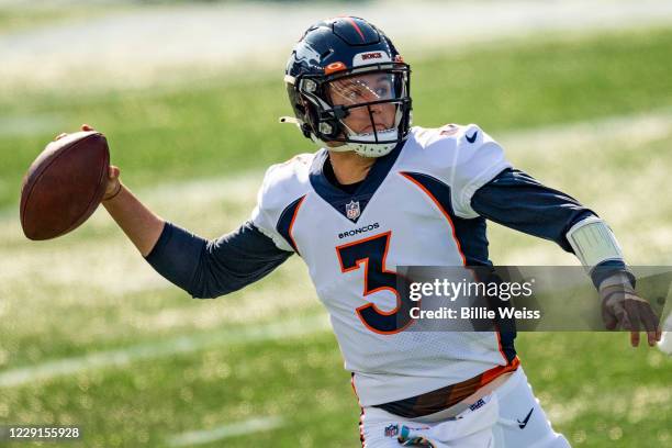 Drew Lock of the Denver Broncos throws during the first half of a game against the New England Patriots at Gillette Stadium on October 18, 2020 in...