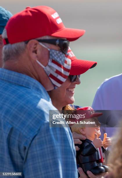 Supporters take photos as they anticipate President Donald Trumps arrival on Air Force One at John Wayne Airport on Sunday, Oct. 18, 2020 in Santa...
