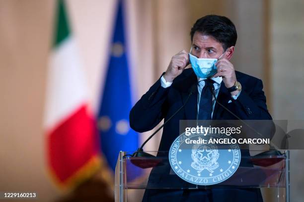 This photo taken on October 18 and provided by Italian news agency ANSA shows Italian Prime Minister Giuseppe Conte giving a press conference to...