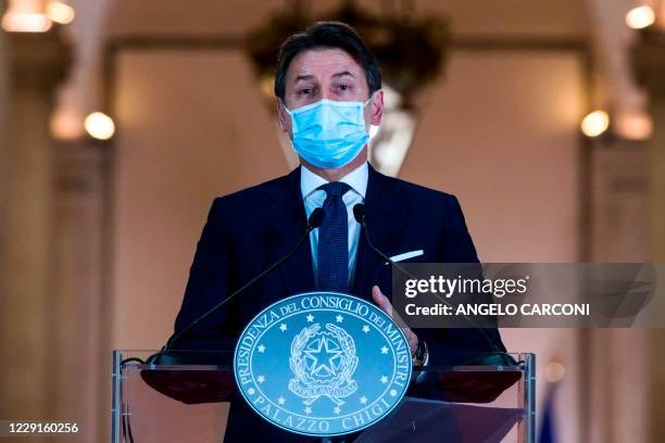 This photo taken on October 18 and provided by Italian news agency ANSA shows Italian Prime Minister Giuseppe Conte giving a press conference to...