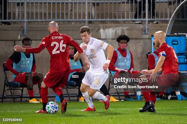 Toronto FC Defender Laurent Ciman and Atlanta United FC Forward Jon Gallagher battle for the ball along with Toronto FC Midfielder Michael Bradley...