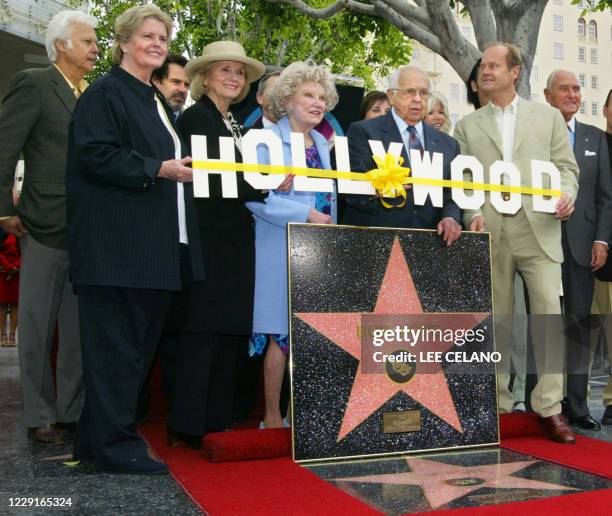 Celebrities and dignitaries pose with a special plaque naming entertainer Bob Hope as "Citizen of the Century" during a dedication ceremony on the...