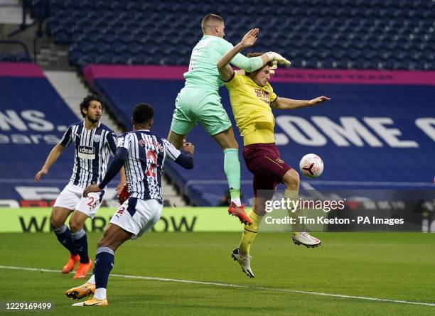 West Bromwich Albion goalkeeper Sam Johnstone drops the ball under pressure from Burnley's Chris Wood during the Premier League match at The...