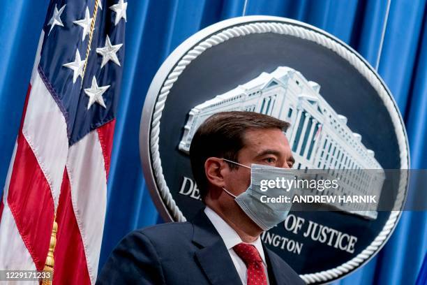 Assistant Attorney General for the National Security Division John Demers appears at a news conference at the Department of Justice, October 19 in...