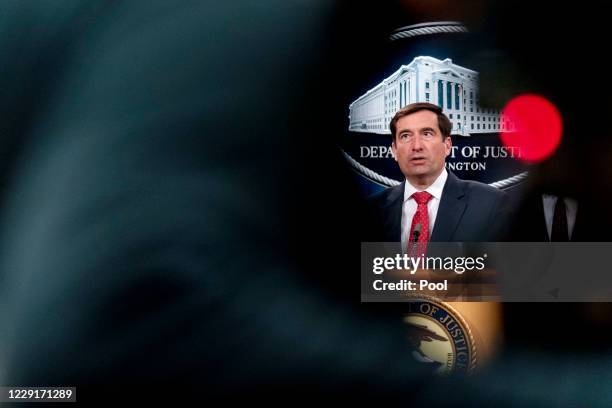 Assistant Attorney General for the National Security Division John Demers speaks at a news conference at the Department of Justice, on October 19,...