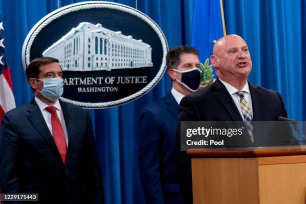 Special Agent in Charge of the Pittsburgh field office Michael Christman, right, accompanied by Assistant Attorney General for the National Security...