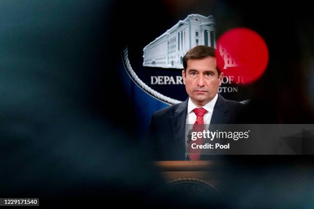 Assistant Attorney General for the National Security Division John Demers takes a question from a reporter via teleconference at a news conference at...