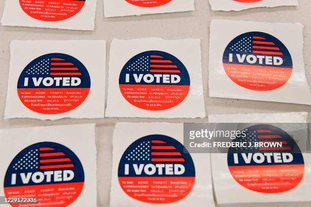 Multi-lingual "I Voted" stickers await voters after they cast their vote in the 2020 US elections at the Los Angeles County Registrar in Norwalk,...