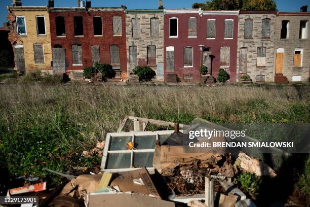 View of boarded up row houses in the Broadway East neighborhood on October 14 in Baltimore, Maryland. - Demon Lane says his east Baltimore...