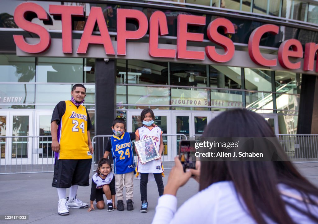 Lakers fans take photos in front of the Staples Center after the Lakers championship win
