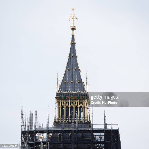 The spire of the Elizabeth Tower of the Houses of Parliament, commonly known as Big Ben, stands free of scaffolding as renovation works further down...