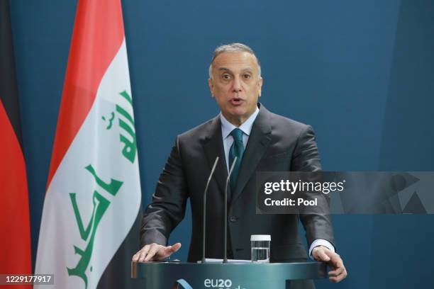 Iraqi Prime Minister Mustafa Al-Kadhimi speaks to the media during a press conference with German Chancellor Angela Merkel at the Chancellery on...